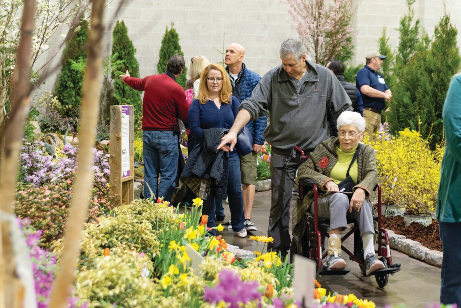 SPRING IN FULL BLOOM: Individuals tour the RI Home Show’s garden experience from past years. This April, Central Nurseries of Johnston will present a “Gardens of the World” garden tour for visitors.
